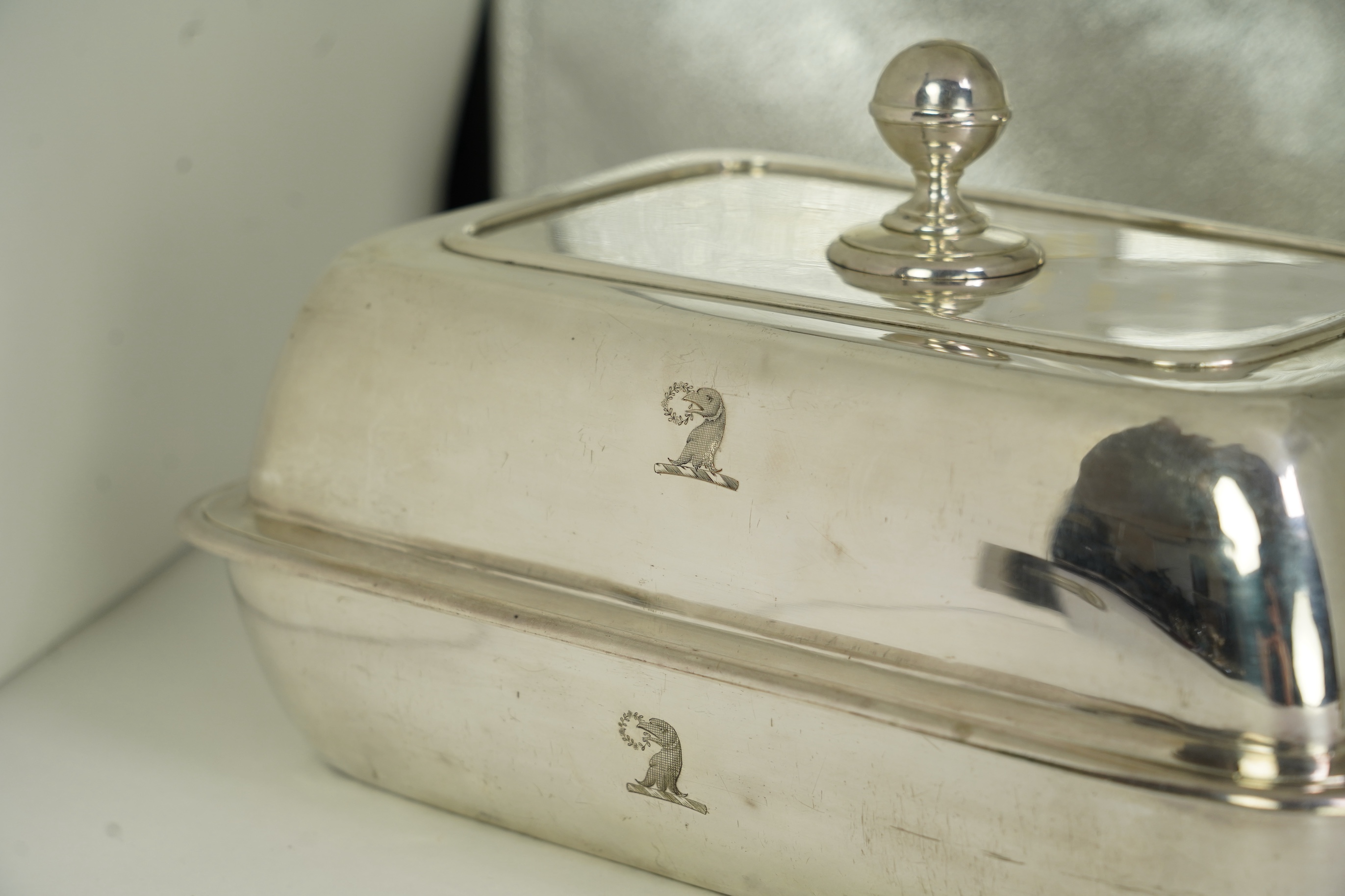 A pair of George IV silver entrée dishes and covers with handles, by John Edward Terry, engraved with the Tregonwell family crest